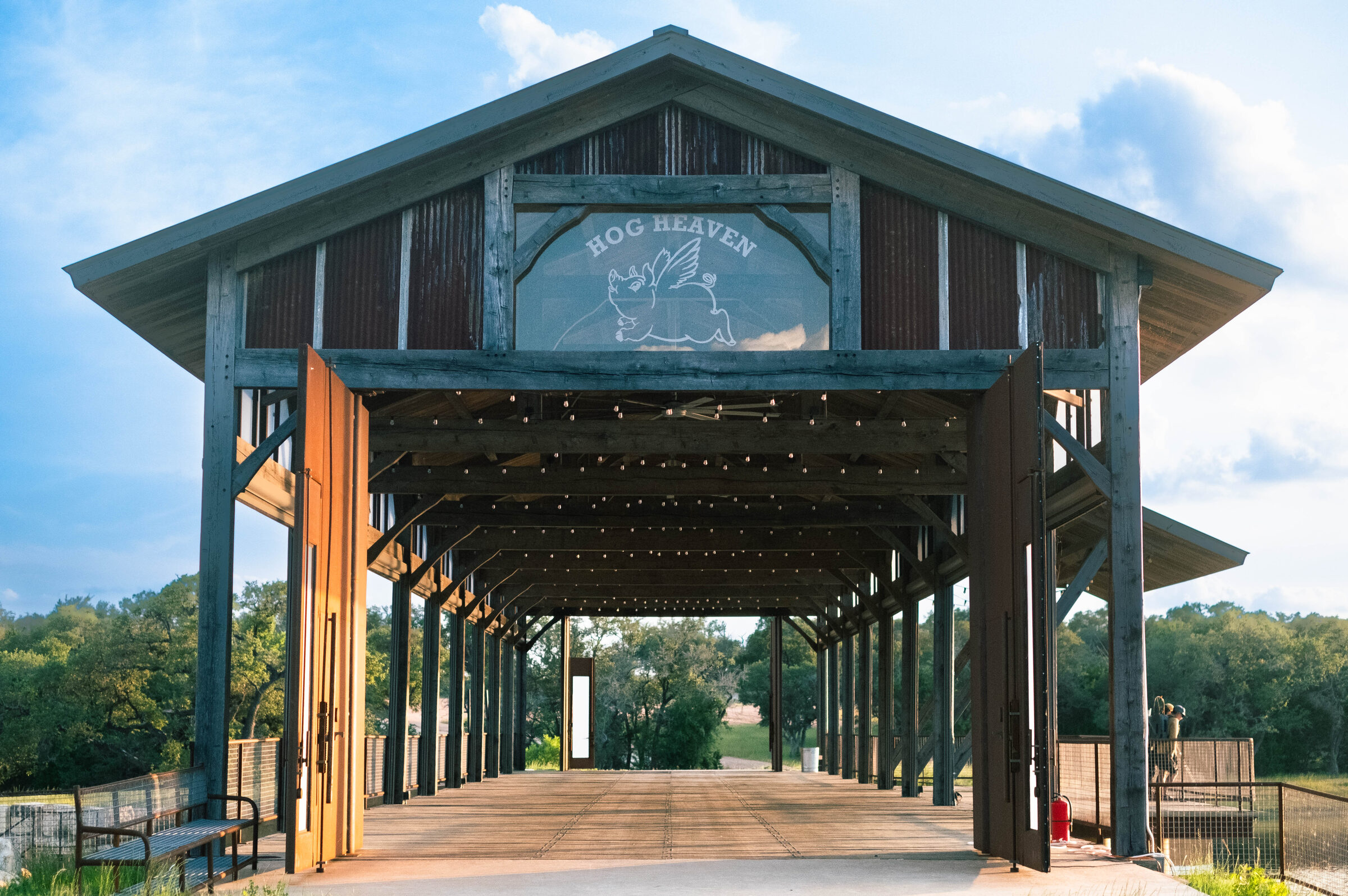 The Party Bridge at Hog Heaven, a covered timber event bridge over the lake