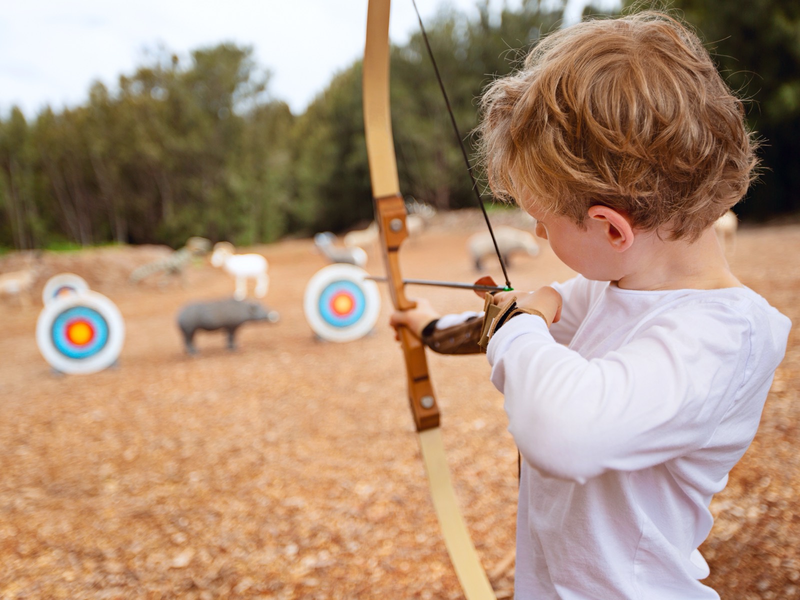 A young archer on the outdoor range