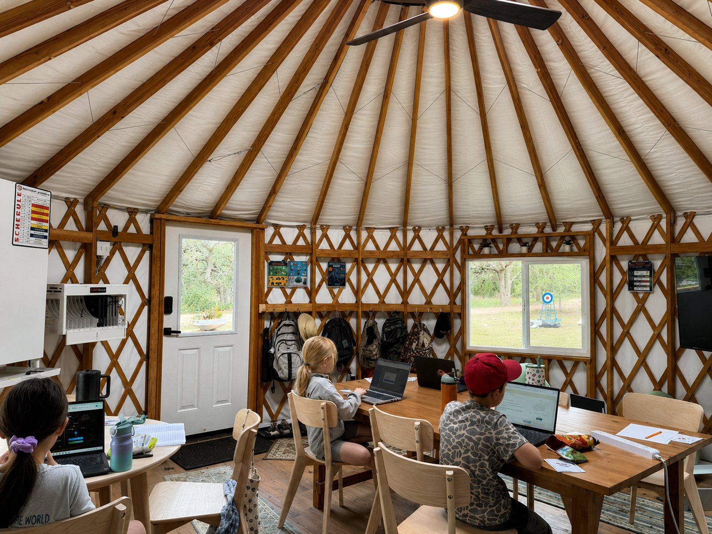 Students at adaptive academics inside a Waypoint yurt classroom